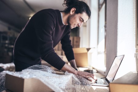 a DSV male customer preparing to send a parcel at his home